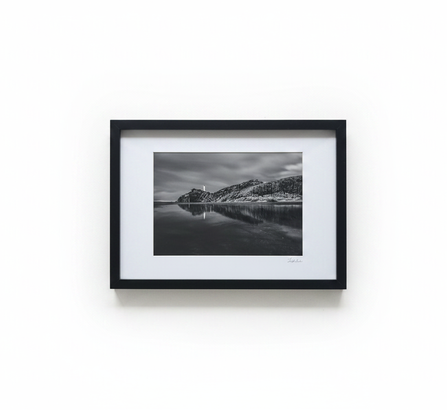 B&W coastal rock frame on white