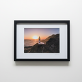 Lighthouse sunset frame on white